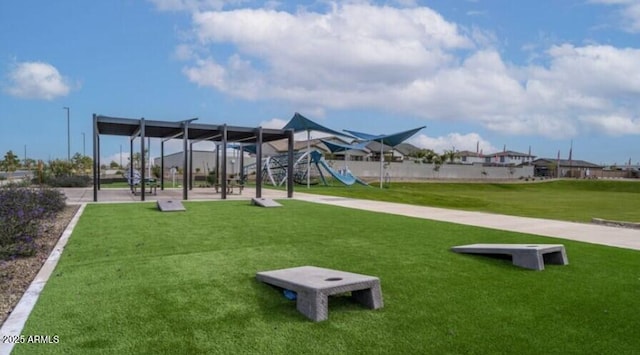 surrounding community featuring a lawn and playground community