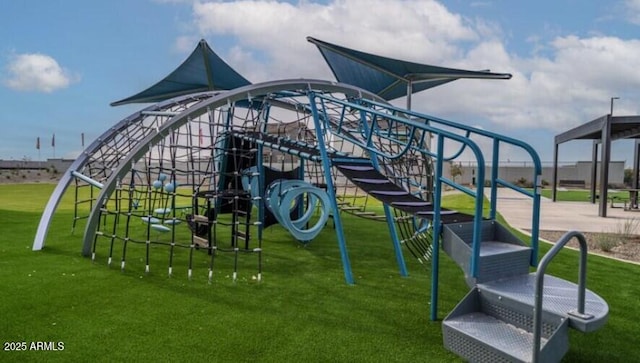 community playground featuring a lawn