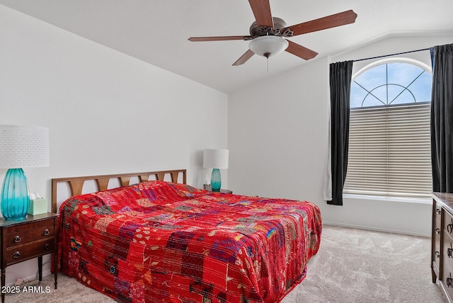 bedroom featuring ceiling fan, vaulted ceiling, and carpet