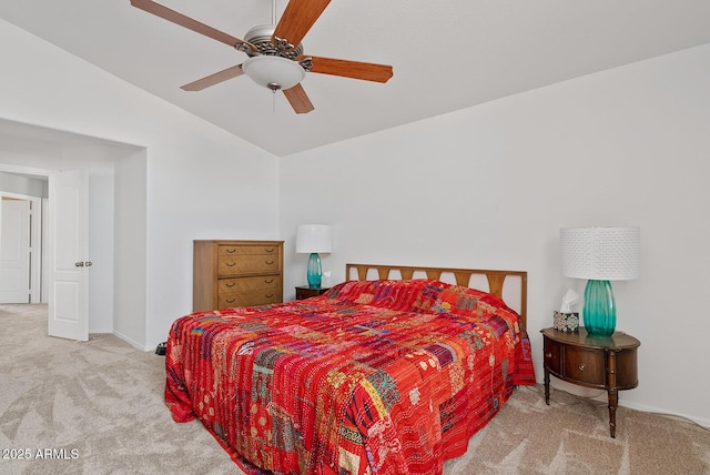 carpeted bedroom featuring baseboards, ceiling fan, and vaulted ceiling