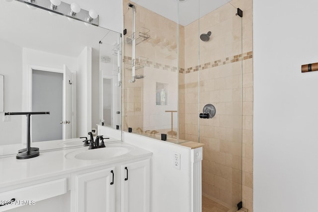 bathroom with vanity and a shower stall