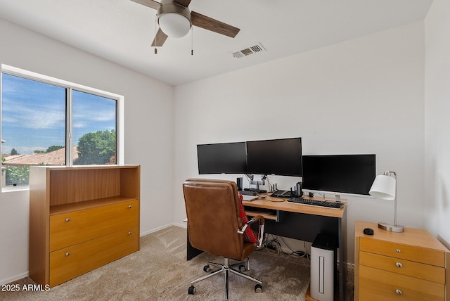 office with a ceiling fan, visible vents, light carpet, and a healthy amount of sunlight