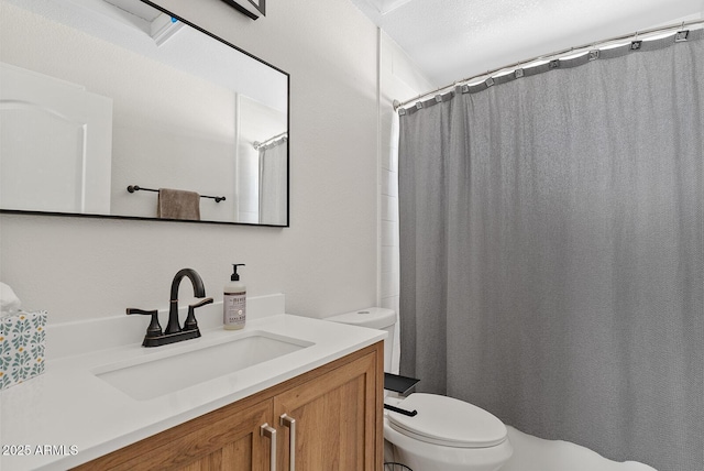 bathroom with vanity, a shower with curtain, and toilet