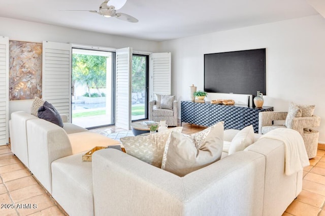 tiled living room featuring ceiling fan