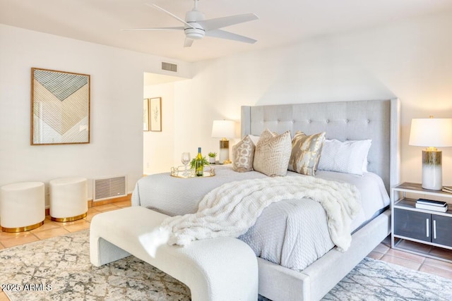 bedroom featuring ceiling fan and tile patterned flooring