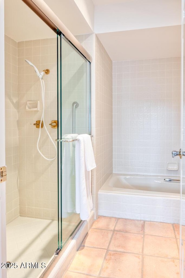 bathroom with tile patterned floors and an enclosed shower