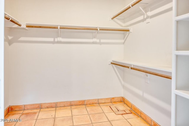 walk in closet featuring light tile patterned floors