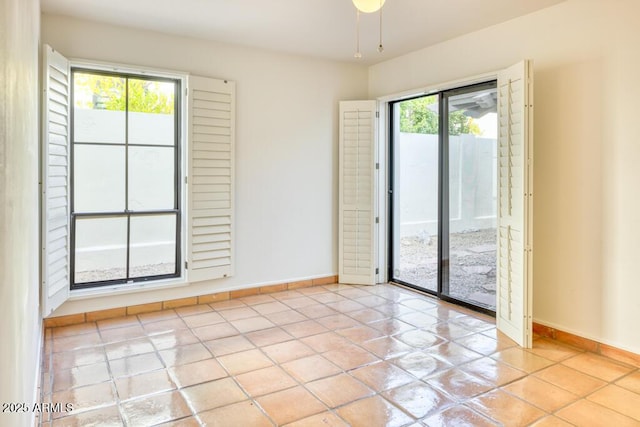 empty room with light tile patterned floors