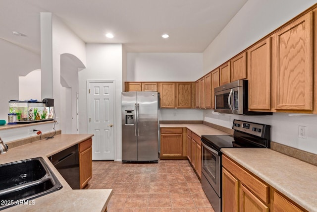 3553 W Dancer Ln, San Tan Valley, AZ 85144 - kitchen with stainless steel appliances, light countertops, and recessed lighting