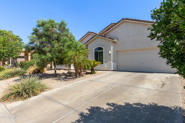 3553 W Dancer Ln, San Tan Valley, AZ 85144 - view of front facade with stucco siding, concrete driveway, and a garage