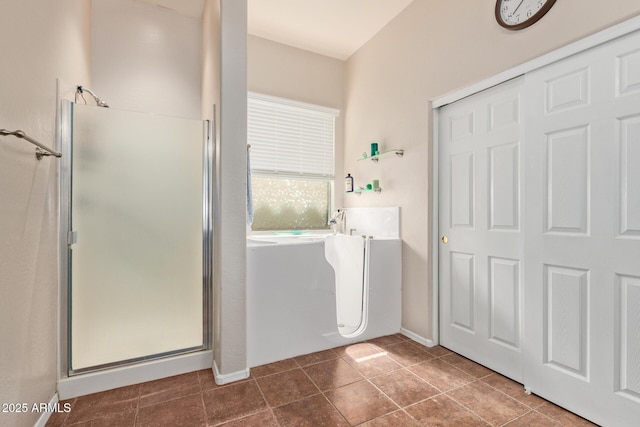3553 W Dancer Ln, San Tan Valley, AZ 85144 - bathroom with a stall shower, a freestanding tub, and tile patterned flooring
