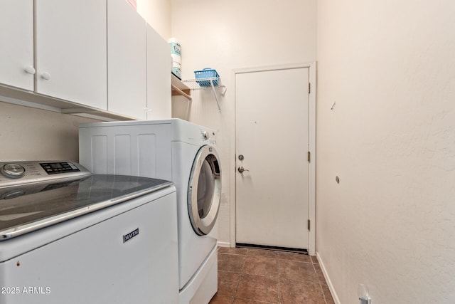 3553 W Dancer Ln, San Tan Valley, AZ 85144 - laundry room with washer and clothes dryer, cabinet space, and dark tile patterned floors