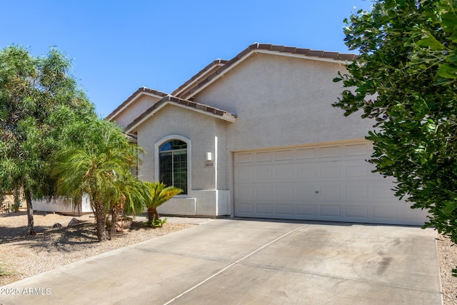 3553 W Dancer Ln, San Tan Valley, AZ 85144 - view of front of house featuring stucco siding, concrete driveway, a tiled roof, and a garage