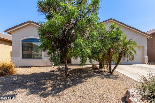 3553 W Dancer Ln, San Tan Valley, AZ 85144 - obstructed view of property with an attached garage, driveway, and stucco siding