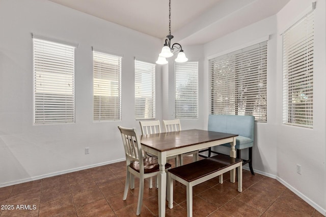 3553 W Dancer Ln, San Tan Valley, AZ 85144 - tiled dining area with a chandelier and baseboards