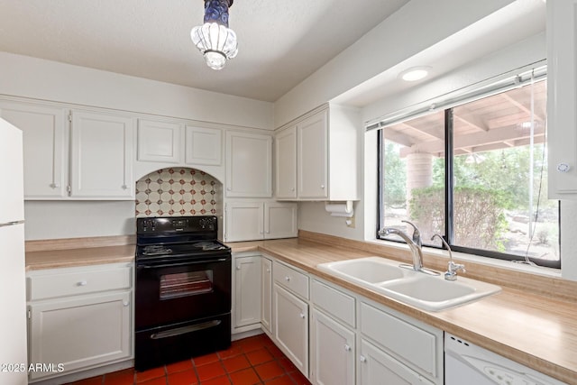 1305 Coyote Pass, Carefree, AZ 85377 - kitchen with white dishwasher, a sink, light countertops, white cabinetry, and black range with electric stovetop