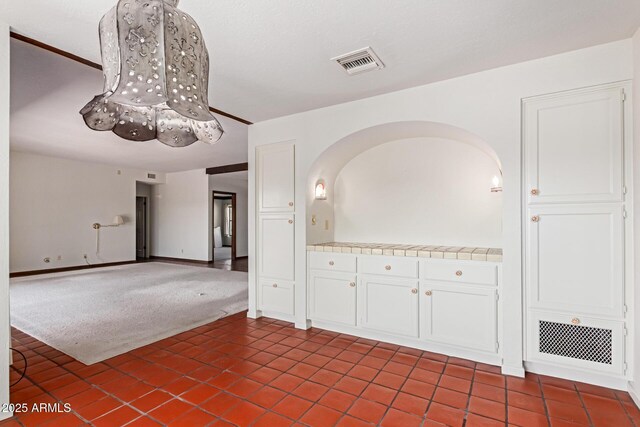 1305 Coyote Pass, Carefree, AZ 85377 - interior space featuring visible vents and dark tile patterned flooring