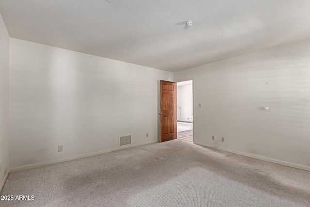 1305 Coyote Pass, Carefree, AZ 85377 - empty room featuring visible vents, baseboards, and carpet floors