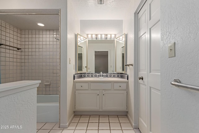 1305 Coyote Pass, Carefree, AZ 85377 - bathroom featuring tile patterned floors, shower / bathing tub combination, vanity, and a textured wall