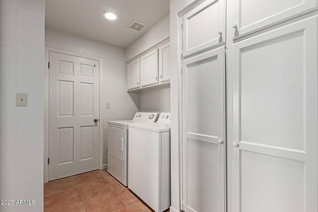 1305 Coyote Pass, Carefree, AZ 85377 - washroom featuring visible vents, light tile patterned floors, recessed lighting, cabinet space, and washing machine and dryer