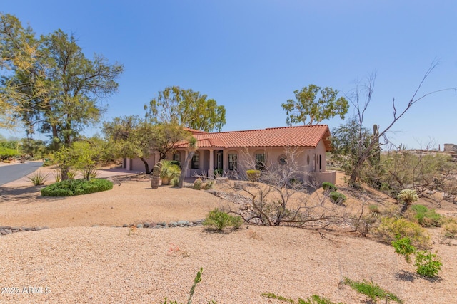 1305 Coyote Pass, Carefree, AZ 85377 - view of front of property with driveway, stucco siding, a tiled roof, and an attached garage