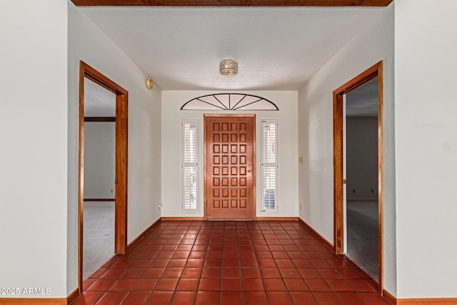 1305 Coyote Pass, Carefree, AZ 85377 - foyer featuring dark tile patterned floors and baseboards