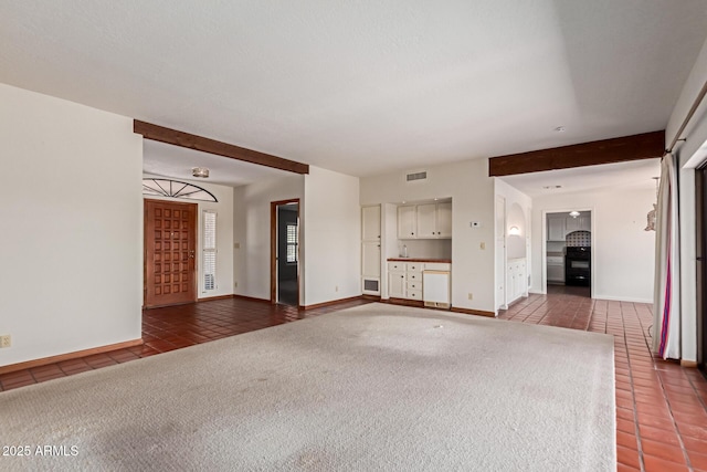 1305 Coyote Pass, Carefree, AZ 85377 - unfurnished living room with carpet, baseboards, tile patterned flooring, and visible vents