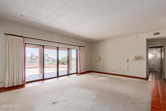 1305 Coyote Pass, Carefree, AZ 85377 - empty room featuring a textured ceiling, carpet, and visible vents
