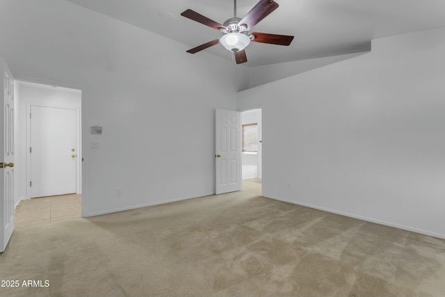 unfurnished room with ceiling fan, light colored carpet, and high vaulted ceiling