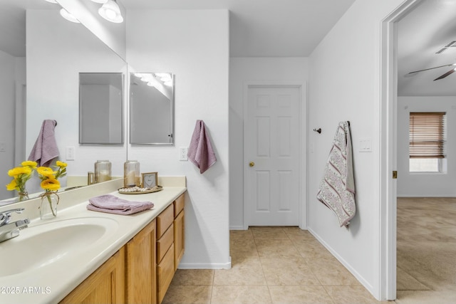 bathroom featuring tile patterned flooring, vanity, and ceiling fan