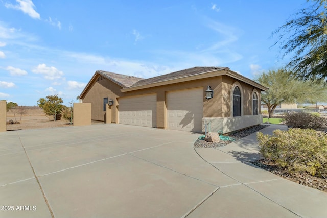 view of side of property featuring a garage