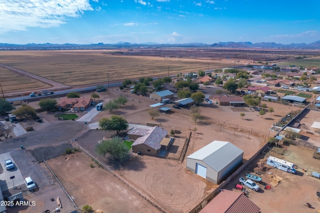 birds eye view of property featuring a mountain view