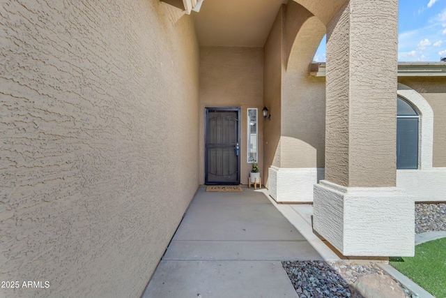 doorway to property with a patio