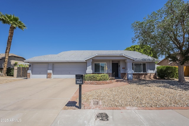 5944 W Greenbriar Dr, Glendale, AZ 85308 - ranch-style home with brick siding, an attached garage, and driveway