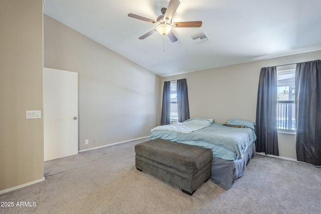 5944 W Greenbriar Dr, Glendale, AZ 85308 - carpeted bedroom with vaulted ceiling, multiple windows, visible vents, and baseboards