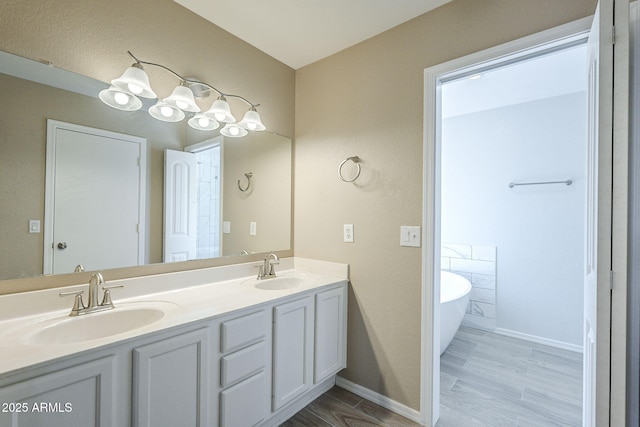 5944 W Greenbriar Dr, Glendale, AZ 85308 - full bath featuring a freestanding bath, baseboards, a sink, and double vanity
