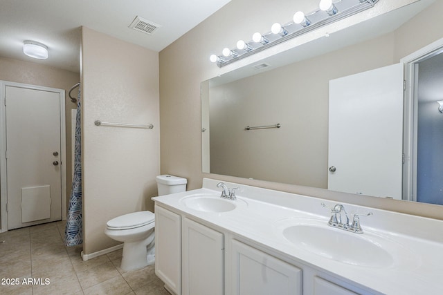 5944 W Greenbriar Dr, Glendale, AZ 85308 - bathroom with tile patterned floors, visible vents, a sink, and toilet