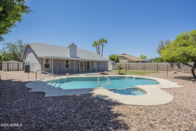 5944 W Greenbriar Dr, Glendale, AZ 85308 - view of pool featuring a fenced backyard, a storage unit, a fenced in pool, and an in ground hot tub