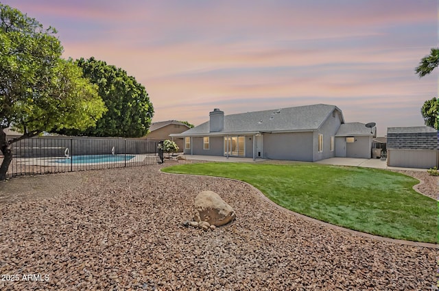 5944 W Greenbriar Dr, Glendale, AZ 85308 - exterior space featuring a chimney, a front lawn, fence, a patio, and a fenced in pool