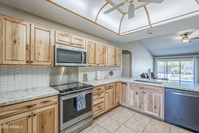 5944 W Greenbriar Dr, Glendale, AZ 85308 - kitchen with light brown cabinets, a ceiling fan, a sink, backsplash, and appliances with stainless steel finishes