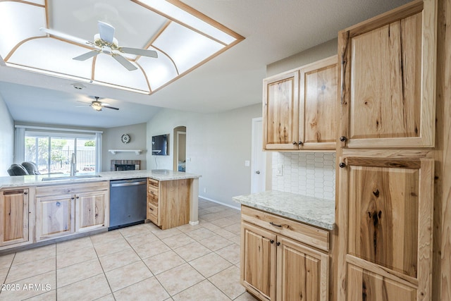 5944 W Greenbriar Dr, Glendale, AZ 85308 - kitchen featuring light brown cabinetry, backsplash, a ceiling fan, stainless steel dishwasher, and a sink