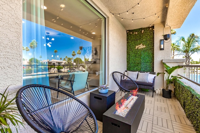 balcony featuring a fire pit