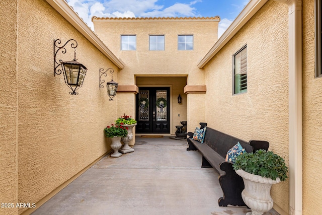 doorway to property featuring french doors