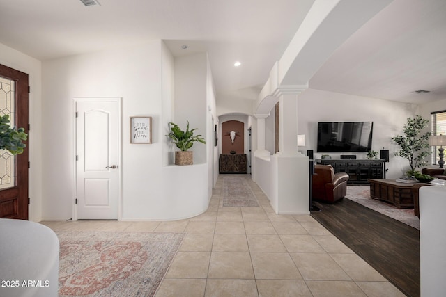 21842 E Via De Olivos, Queen Creek, AZ 85142 - entrance foyer featuring decorative columns, arched walkways, light tile patterned flooring, and recessed lighting