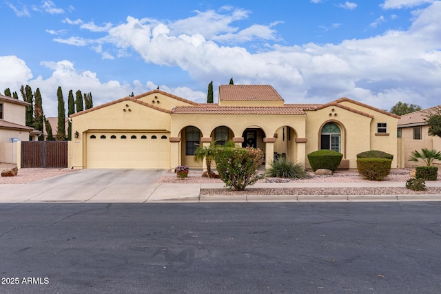 21842 E Via De Olivos, Queen Creek, AZ 85142 - mediterranean / spanish-style house with stucco siding, a garage, a tile roof, and driveway