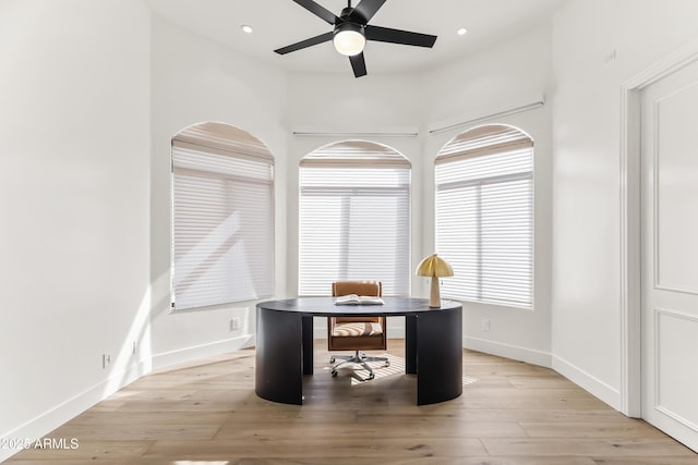 office space with recessed lighting, light wood-style flooring, a ceiling fan, and baseboards