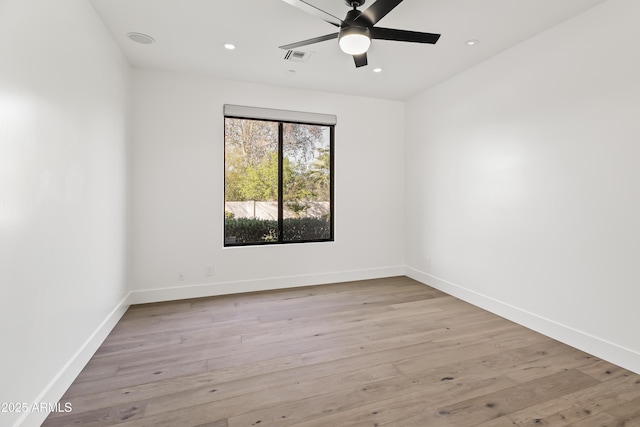 unfurnished room featuring recessed lighting, baseboards, wood finished floors, and a ceiling fan