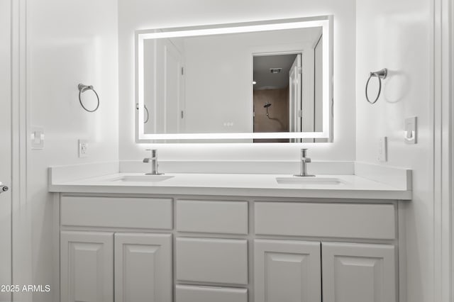 full bath featuring double vanity and a sink