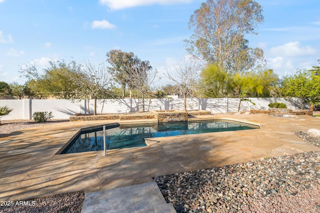 view of swimming pool with a fenced in pool, a fenced backyard, and a patio area