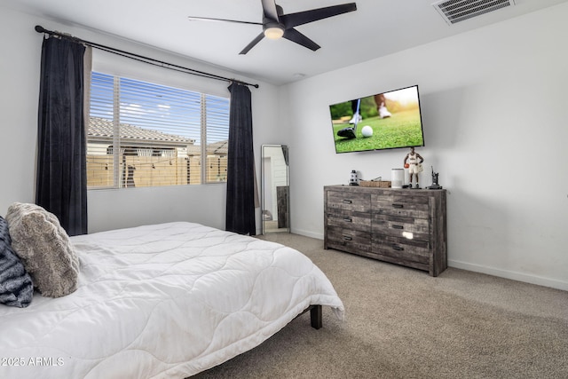 bedroom with ceiling fan and light colored carpet